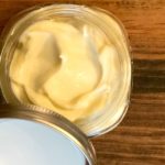 How To Make The Best Homemade Moisturizer For Dry Winter Skin top view of mason jar filled with lotion