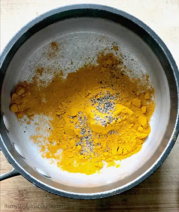 Adding turmeric and pepper to make Golden Paste