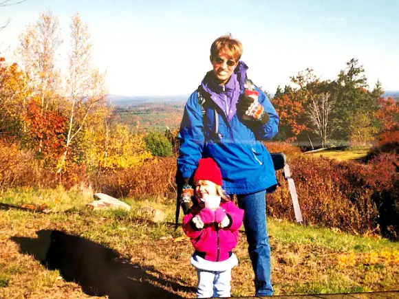 Motherhood What It Means To You mother and daughter on hike in fall