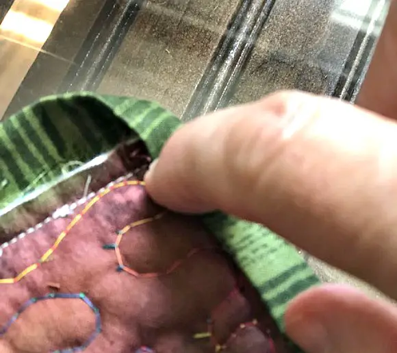 Simple Quilted Potholder Tutorial demonstrating how to fold corners for edges