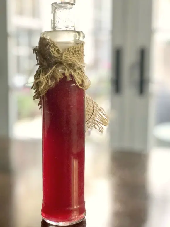 Elderberry Syrup (A Robust Cold & Flu Remedy) syrup displayed in decorative decanter