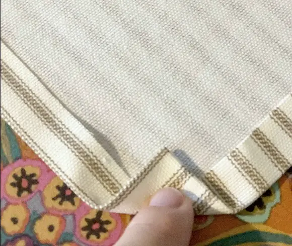 Make Your Own DIY Tea Towels closeup view of how to fold corners to miter