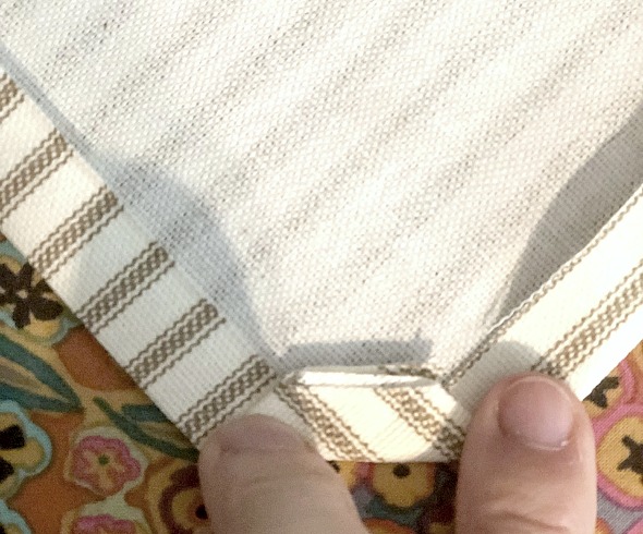 Make Your Own DIY Tea Towels showing cut in corner so that the fabric can be folded easily to miter