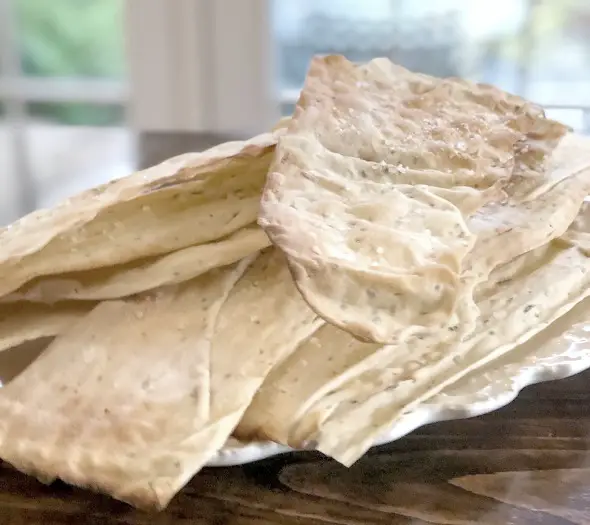 Easy Homemade Flatbread Crackers closeup of stacked crackers