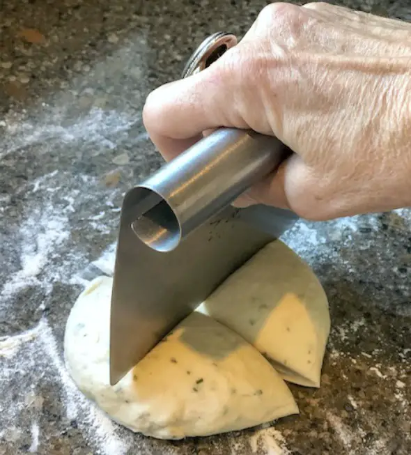 Easy Homemade Flatbread Crackers dough being cut into quarters