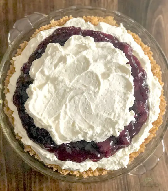 Cherry Cheese Pie top view of cherry cheese pie with cream on top