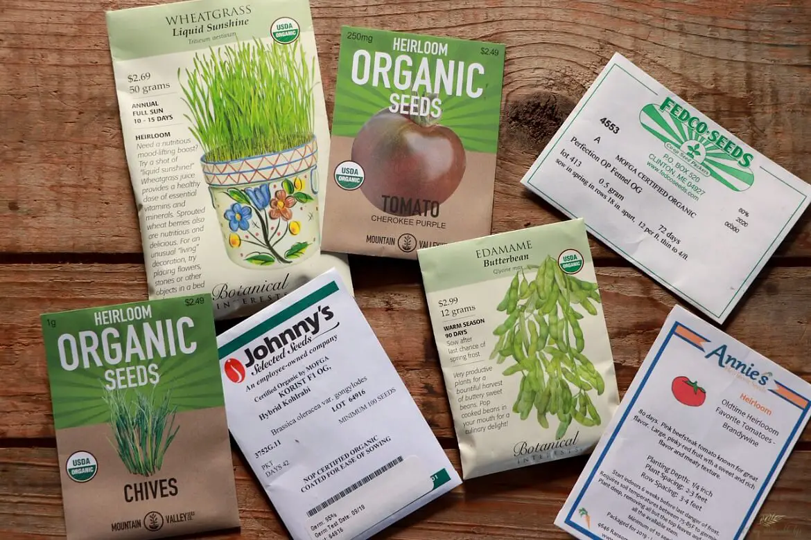 Reading & Understanding Seed Packets Reading & Understanding Seed Packets display of seed packets from different companies on a wooden board