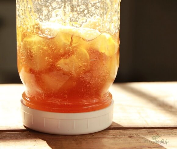 Honey Fermented Garlic image of mason jar turned upside down to coat garlic cloves in honey