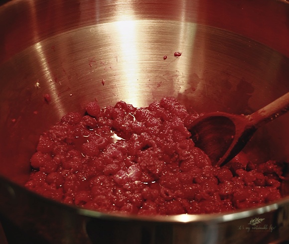 Red Raspberry Jam showing raspberry mixture cooking in pan