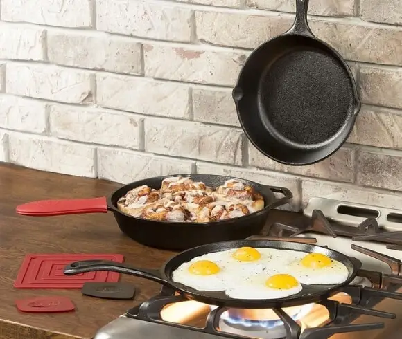 Gifts For Homesteaders image of cast iron cookware on stove being used to cook eggs and more