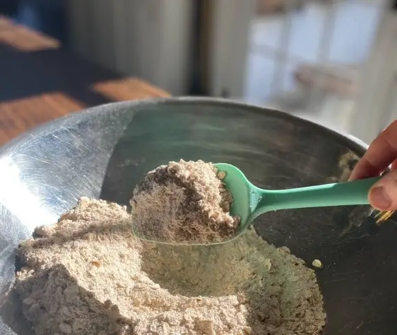 Homemade Gluten-Free Apple Crisp image showing bowl of dried ingredients being mixed together