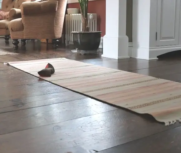 How To Boost Your Immune System Naturally This Winter image of stripped yoga mat with eye pillow resting on the mat