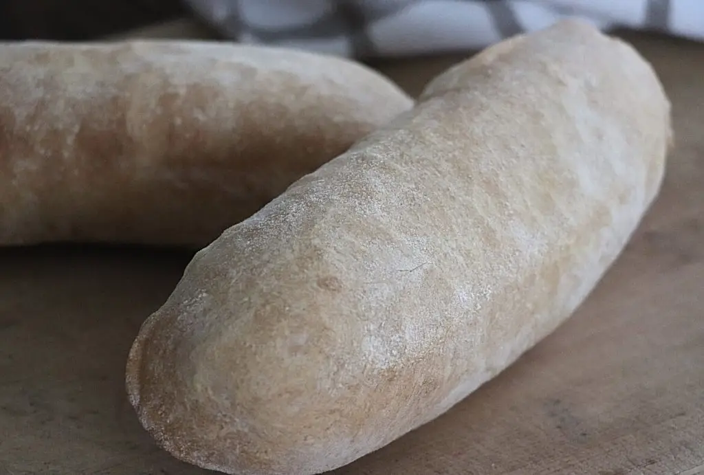 Homemade Baguettes image showing 2 baked crusty rolls shaped like sub rolls