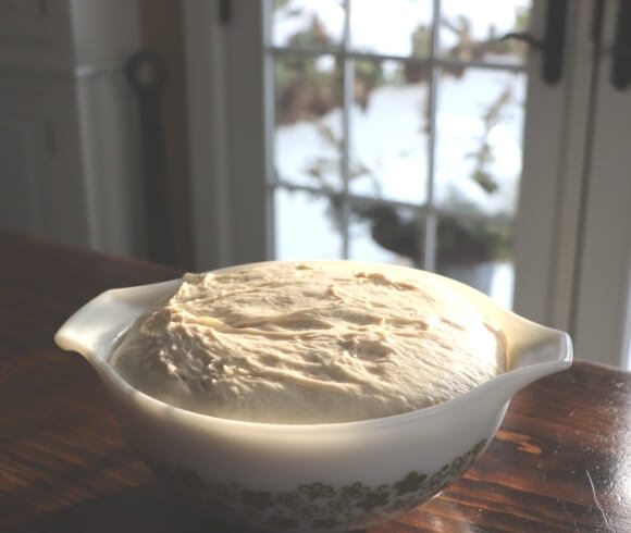 Homemade Baguettes image showing bowl of dough that has risen and is highlighted by late day light